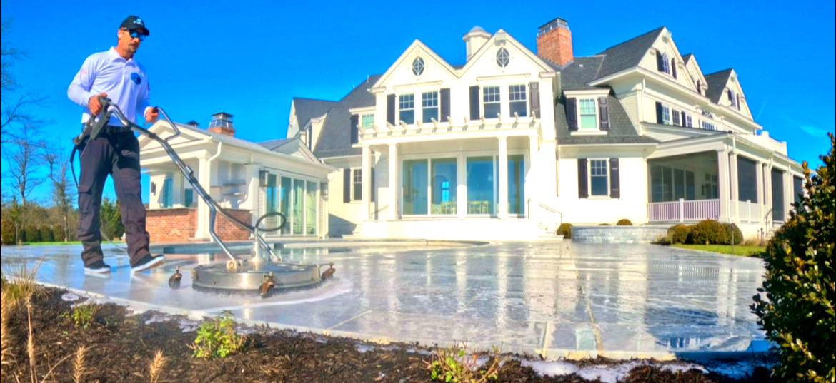 technician performing exterior cleaning in Rumson, NJ